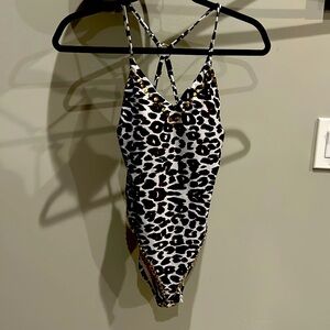 Leopard print swim suit by juicy couture small.  So cute with metal trim.